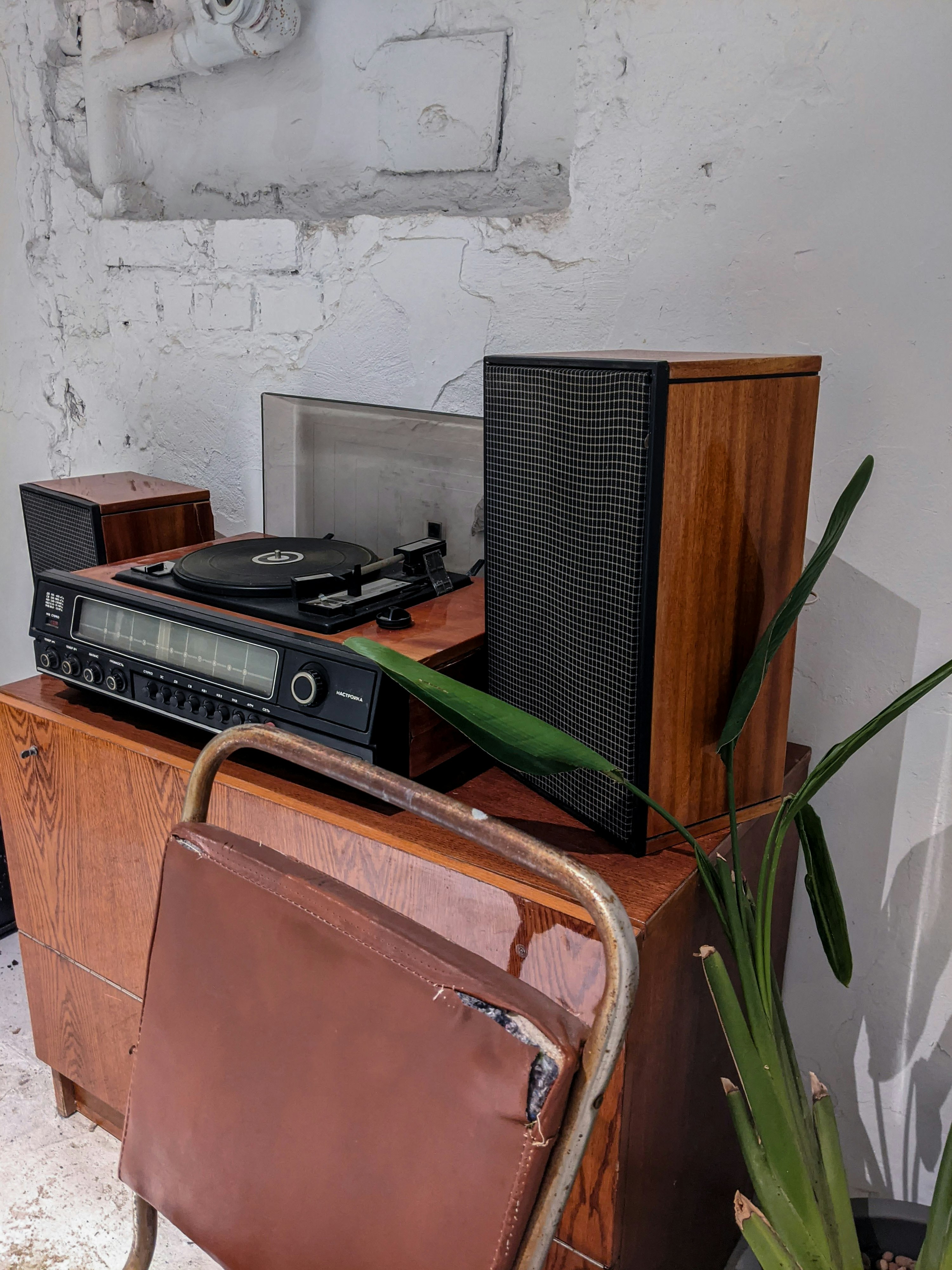 black and brown radio on brown wooden table
